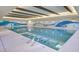 Bright indoor pool with artistic wall design and comfortable seating creating a relaxing atmosphere at 18150 W Tanglewood Dr, Goodyear, AZ 85338