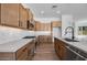 Kitchen with stainless-steel appliances, quartz countertop and tiled backsplash at 18150 W Tanglewood Dr, Goodyear, AZ 85338