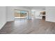 Open living space with kitchen and sliding glass doors at 18150 W Tanglewood Dr, Goodyear, AZ 85338