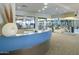 Welcoming lobby with a reception desk, gym view, and modern decor for a stylish entrance at 18150 W Tanglewood Dr, Goodyear, AZ 85338