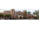 Attractive Village Center featuring a terracotta tile roof and well-maintained landscaping at 18150 W Tanglewood Dr, Goodyear, AZ 85338