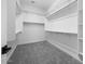 Walk-in closet with installed shelving and bars for hanging clothing at 18150 W Tanglewood Dr, Goodyear, AZ 85338