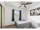Simple bedroom with a ceiling fan, a comfortable bed, and natural light at 18309 N 39Th Ave, Glendale, AZ 85308