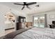 Bright bedroom features a ceiling fan, pool access, and an ensuite bathroom at 18309 N 39Th Ave, Glendale, AZ 85308