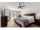 Cozy bedroom with a ceiling fan, carpet, and access to a private pool area at 18309 N 39Th Ave, Glendale, AZ 85308