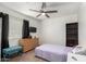 Cozy bedroom showcasing a comfortable bed, dresser, and a relaxing sitting area at 18309 N 39Th Ave, Glendale, AZ 85308