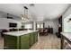 Open-concept kitchen and living area with a large island perfect for entertaining at 18309 N 39Th Ave, Glendale, AZ 85308