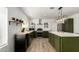 Well-lit kitchen boasts stainless steel appliances, quartz countertops, and a stylish island at 18309 N 39Th Ave, Glendale, AZ 85308