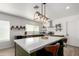 Bright kitchen features a large island, stainless steel appliances, and modern lighting fixtures at 18309 N 39Th Ave, Glendale, AZ 85308