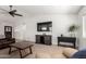 Inviting living room featuring a ceiling fan and a media center with stylish decor at 18309 N 39Th Ave, Glendale, AZ 85308