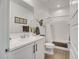 Well-lit bathroom with vanity, modern fixtures, decorative accents, and a shower-over-tub combination at 1919 W Hide Trl, Phoenix, AZ 85085