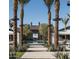 Picturesque community pool area with palm trees, stylish cabanas, and inviting lounge seating for relaxation and enjoyment at 1919 W Hide Trl, Phoenix, AZ 85085