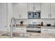 Close-up of a modern kitchen showcasing granite countertops, stainless steel appliances, and a stylish faucet and sink at 1919 W Hide Trl, Phoenix, AZ 85085