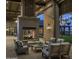 Inviting outdoor fireplace with comfortable seating area, perfect for relaxation amidst a beautifully designed community space at 1919 W Hide Trl, Phoenix, AZ 85085