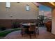 Cozy outdoor patio with a fire pit table and chairs; perfect for relaxing and entertaining guests at 1919 W Hide Trl, Phoenix, AZ 85085