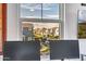 A stunning view of a neighborhood with mountains in the background is seen through a window at 1919 W Hide Trl, Phoenix, AZ 85085