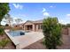 Beautiful backyard showcasing a sparkling pool with spa, a spacious patio area, and mature trees for shade and privacy at 22296 E Maya Rd, Queen Creek, AZ 85142