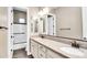Bathroom features a double vanity with granite countertops, modern fixtures, and a shower-tub combo at 22296 E Maya Rd, Queen Creek, AZ 85142