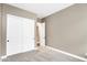 A spacious bedroom featuring neutral walls, plush carpet, and a closet for efficient storage at 22296 E Maya Rd, Queen Creek, AZ 85142