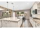 Beautiful kitchen island with stone countertops, sink, breakfast bar, and stainless steel appliances at 22296 E Maya Rd, Queen Creek, AZ 85142