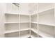 Well-organized pantry featuring ample shelving and a bright, clean design for efficient storage at 22296 E Maya Rd, Queen Creek, AZ 85142
