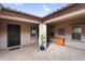 Covered patio featuring brick pavers, neutral walls, and elegant decor, creating an inviting outdoor living space at 22296 E Maya Rd, Queen Creek, AZ 85142