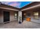 Covered patio featuring brick pavers, neutral walls, and elegant decor, creating an inviting outdoor living space at 22296 E Maya Rd, Queen Creek, AZ 85142