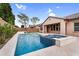 Gorgeous pool area with a built-in spa, water feature, and ample patio space, perfect for enjoying sunny days at 22296 E Maya Rd, Queen Creek, AZ 85142
