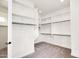 Bright walk-in closet with ample shelving and rod space for optimal storage and organization at 22296 E Maya Rd, Queen Creek, AZ 85142