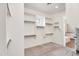 Organized walk-in closet with built-in shelving and storage solutions, with easy access to the bathroom at 22296 E Maya Rd, Queen Creek, AZ 85142