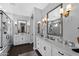 Luxurious primary bathroom featuring dual vanities, a glass shower, and elegant finishes at 22302 E Russet Rd, Queen Creek, AZ 85142