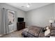 Bright bedroom featuring a window, TV, and comfortable bed, creating a cozy space for relaxation and entertainment at 22302 E Russet Rd, Queen Creek, AZ 85142