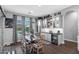 Charming dining area with a built-in bar, stylish decor, and views of the backyard at 22302 E Russet Rd, Queen Creek, AZ 85142