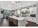 Spacious kitchen with a large center island, stainless steel appliances, and a dining area with backyard views at 22302 E Russet Rd, Queen Creek, AZ 85142