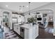 Bright, modern kitchen with a center island, stainless steel appliances, and open to the living area at 22302 E Russet Rd, Queen Creek, AZ 85142