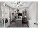 Well-lit home office with neutral gray walls, built-in cabinets, and modern furnishings at 22302 E Russet Rd, Queen Creek, AZ 85142