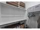 Practical walk-in closet provides efficient storage, shelving, and hanging space for a tidy and organized wardrobe at 22302 E Russet Rd, Queen Creek, AZ 85142