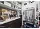 Elegant walk-in closet features custom shelving, drawers, and a vanity area with stylish decor and ample storage at 22302 E Russet Rd, Queen Creek, AZ 85142