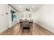 Well-lit dining room featuring neutral walls and tones, contemporary lighting and a large window at 2236 W Shaw Butte Dr, Phoenix, AZ 85029
