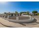 Charming home with an eye-catching circular gravel driveway enclosed by a wrought iron and stucco fence at 2236 W Shaw Butte Dr, Phoenix, AZ 85029