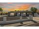 Charming single-story home with dark trim, a gated front yard, and beautiful sunset sky at 2236 W Shaw Butte Dr, Phoenix, AZ 85029