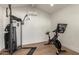 Clean and bright home gym with modern exercise equipment and light wood flooring at 2236 W Shaw Butte Dr, Phoenix, AZ 85029