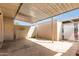 The home's covered back patio has a block privacy wall and a white storage shed at 225 N Standage -- # 30, Mesa, AZ 85201