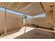 This covered back patio has a small garden and offers views of the backyard and neighboring properties at 225 N Standage -- # 30, Mesa, AZ 85201