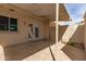 The back patio has a covered awning, white brick walls, and a door with access to the house at 225 N Standage -- # 30, Mesa, AZ 85201