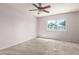 Bedroom with a ceiling fan, neutral carpet and a window view at 225 N Standage -- # 30, Mesa, AZ 85201