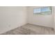 This bedroom has neutral carpet, a window with outside views, and white walls at 225 N Standage -- # 30, Mesa, AZ 85201