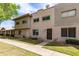 Charming townhome complex featuring well-manicured lawns and inviting walkways at 225 N Standage -- # 30, Mesa, AZ 85201