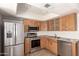 Bright eat-in kitchen with stainless steel appliances and light wood cabinets at 225 N Standage -- # 30, Mesa, AZ 85201