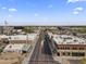 This aerial shot shows a vibrant street with shops and businesses in a sunny, charming city center at 232 W San Angelo St, Gilbert, AZ 85233